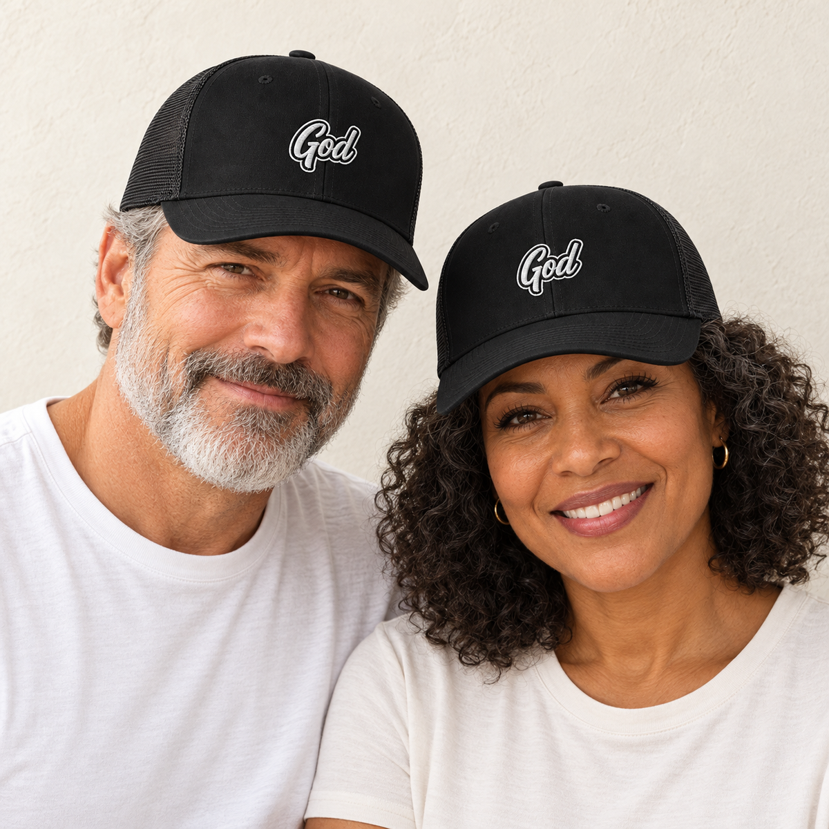 God Embroidered Trucker Hat — Black — man and woman — ivory background