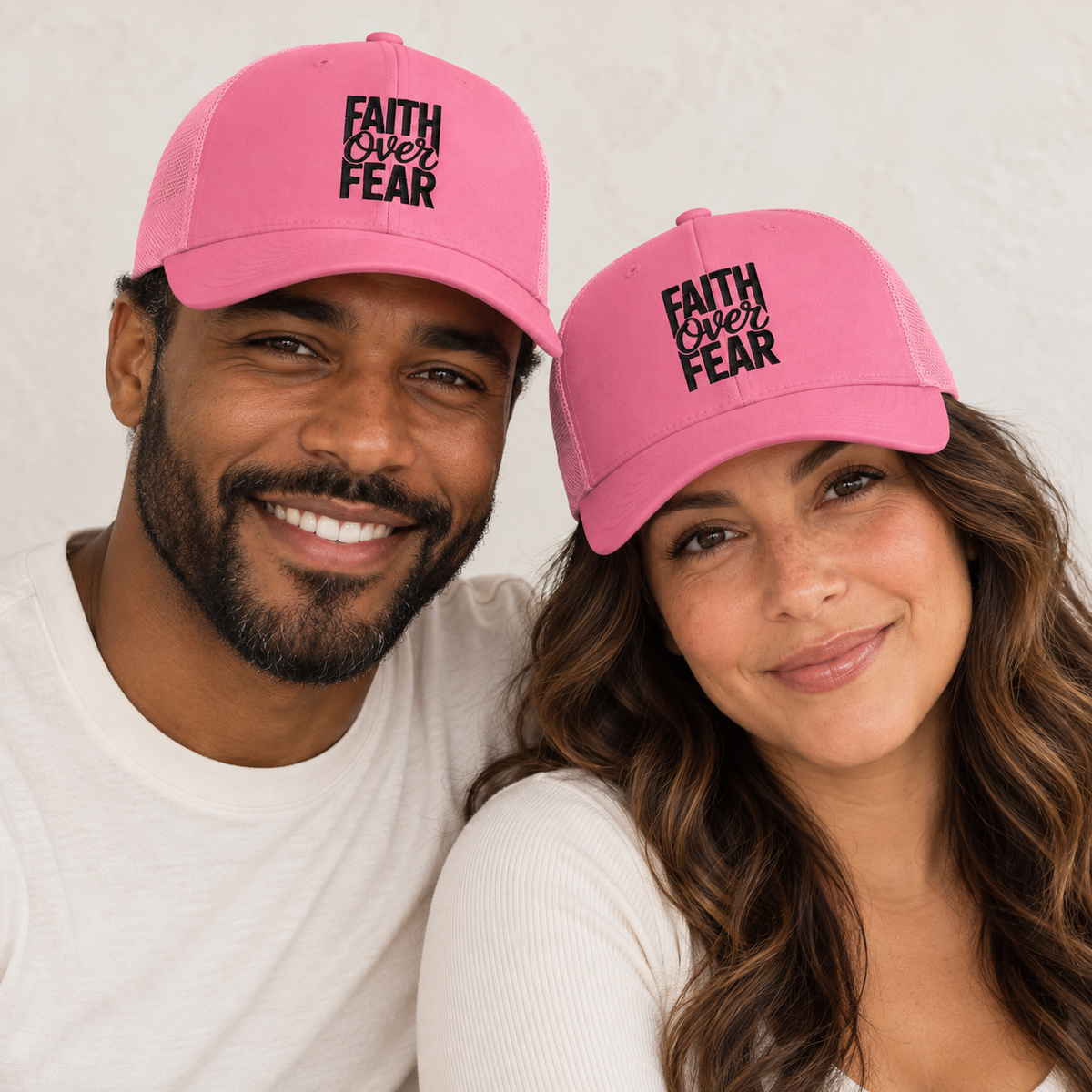 Faith Over Fear Embroidered Trucker Hat — Pink — man and woman — ivory background