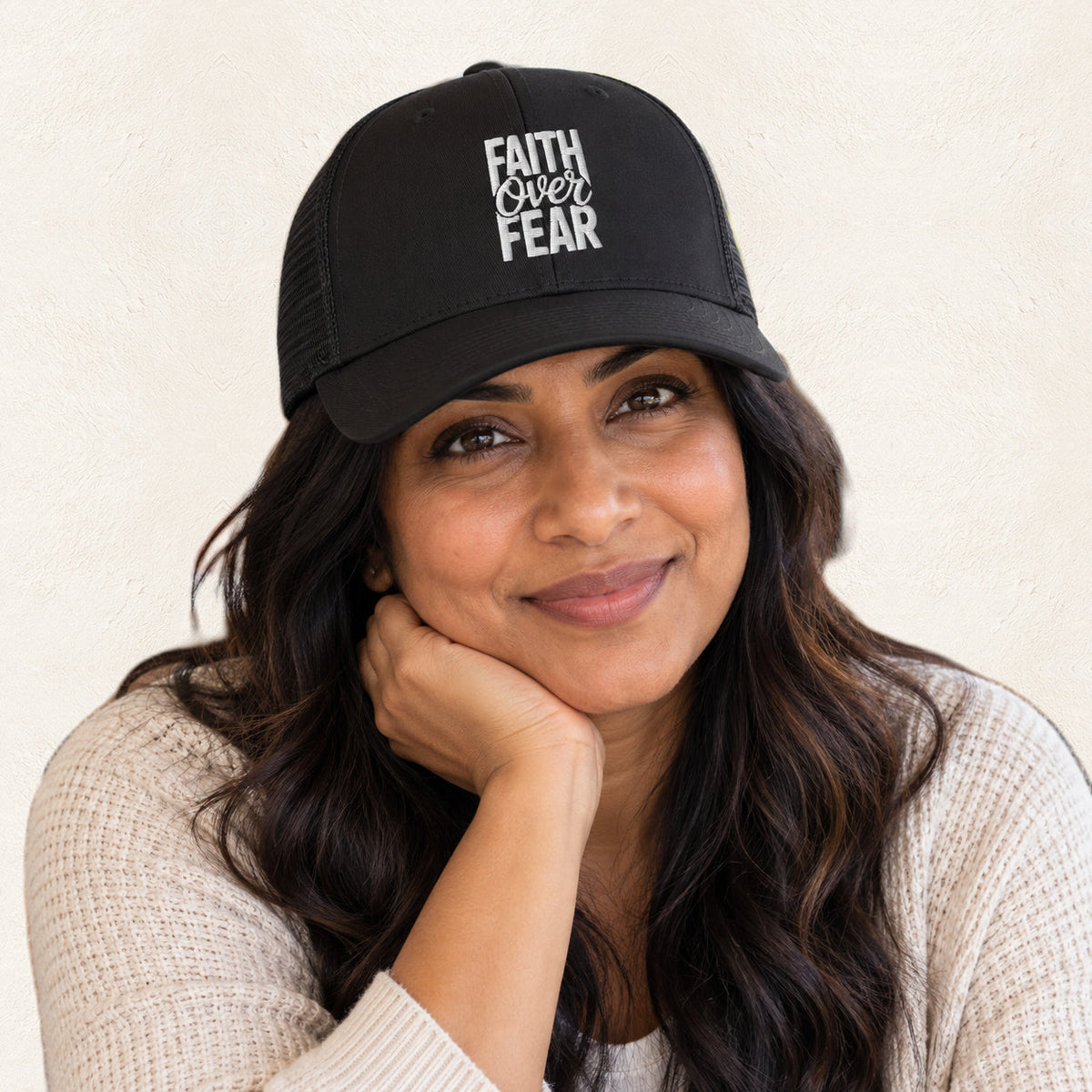 Faith Over Fear Black Embroidered Trucker Hat — original product and design — warm ivory background