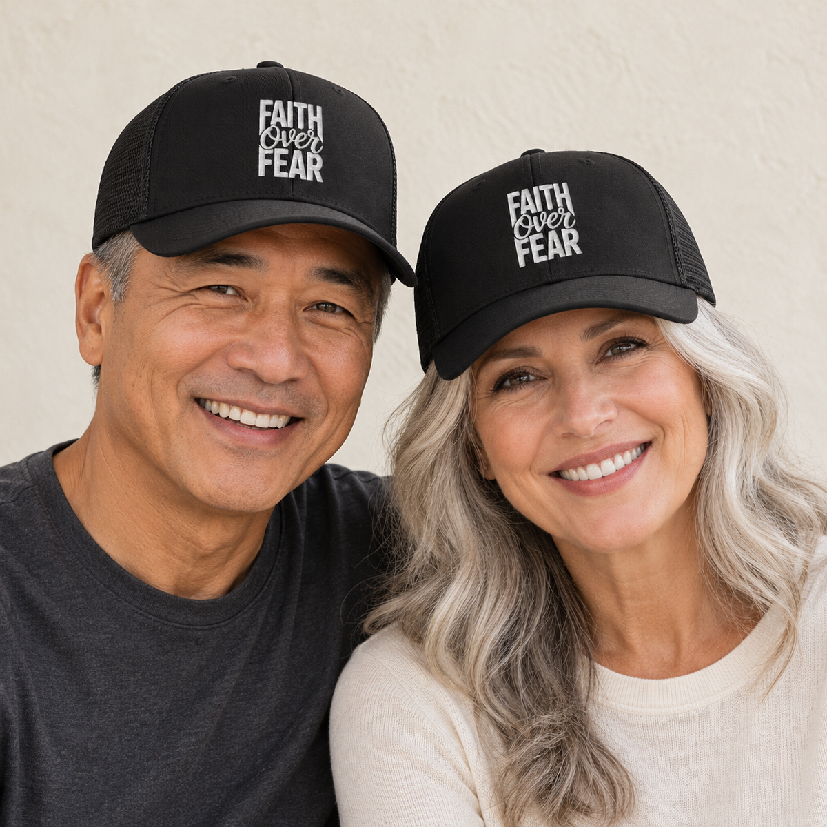 Faith Over Fear Black Embroidered Trucker Hat — Black — man and woman — ivory background