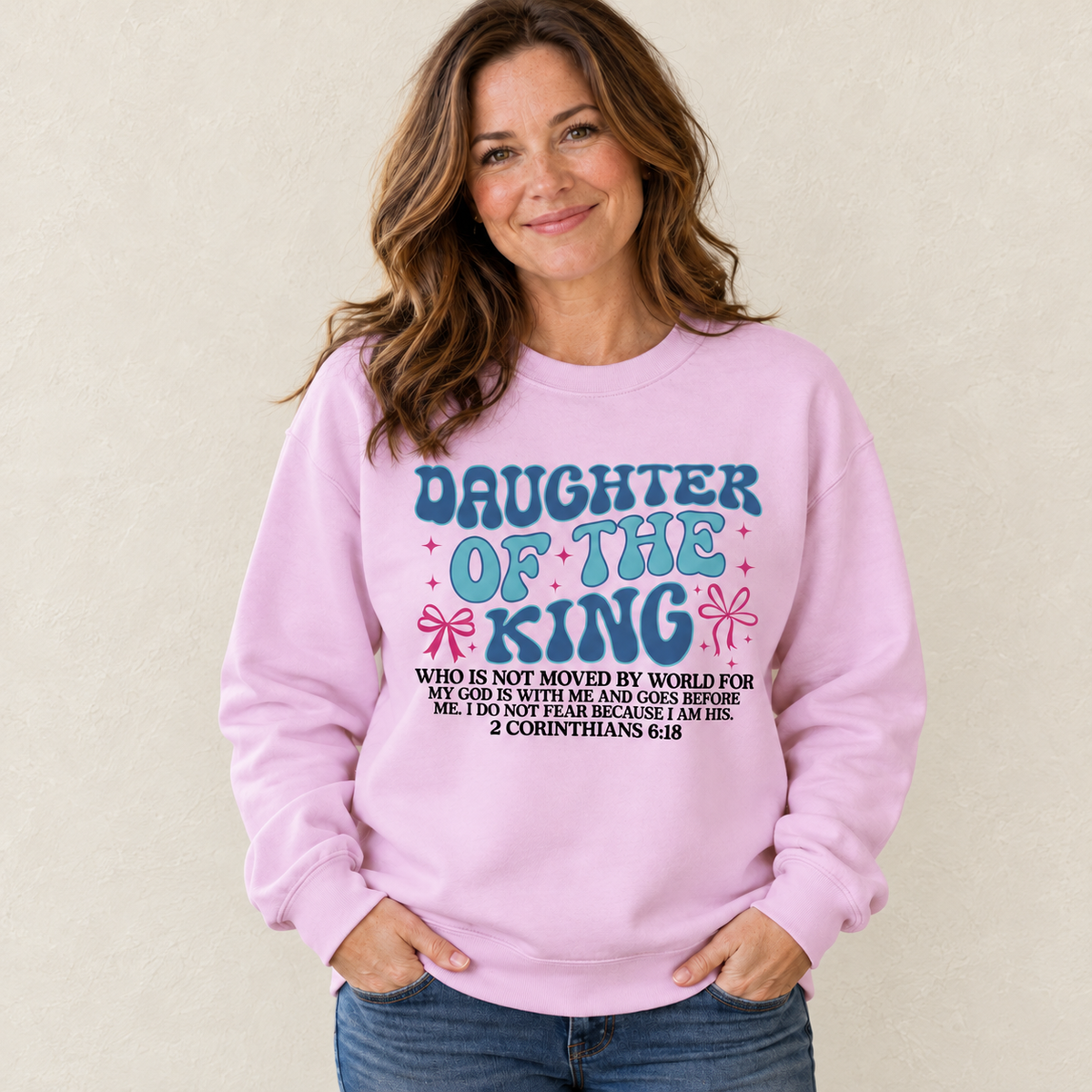 Daughter of the King Sweatshirt — original model and design, warm ivory background