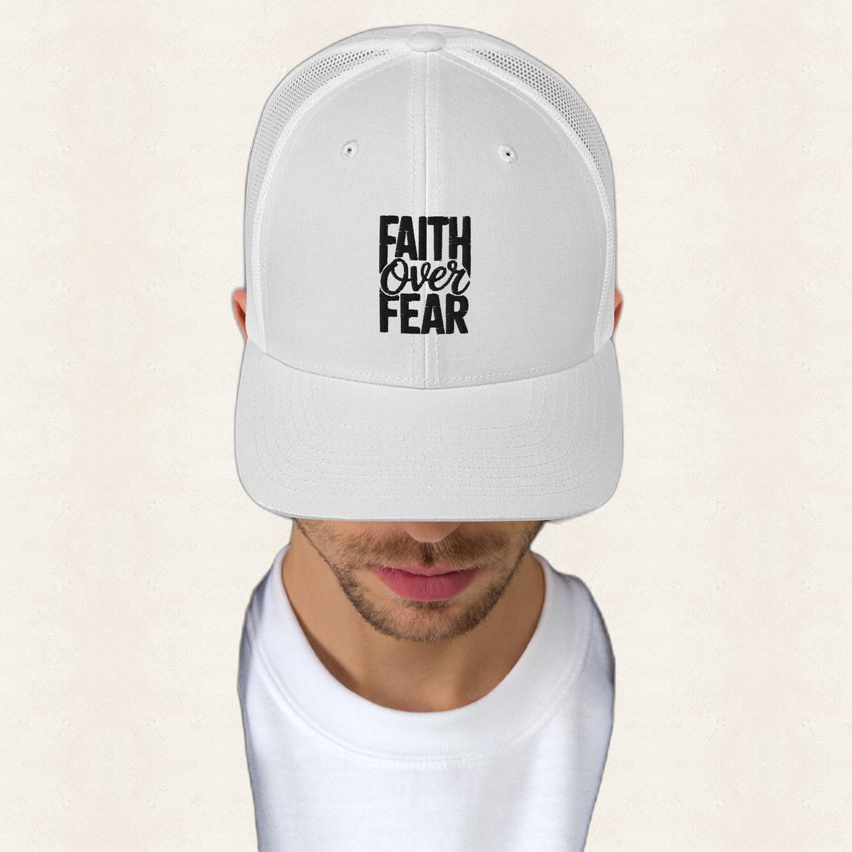 Faith Over Fear Embroidered Trucker Hat — original product and design — warm ivory background